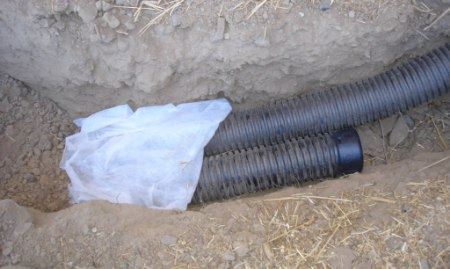 A French drain system being installed