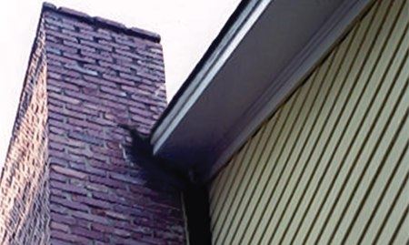 Before and after image showing a leaning chimney and then the repaired straightened chimney.