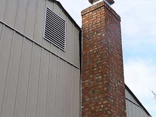brick chimney separating from a building