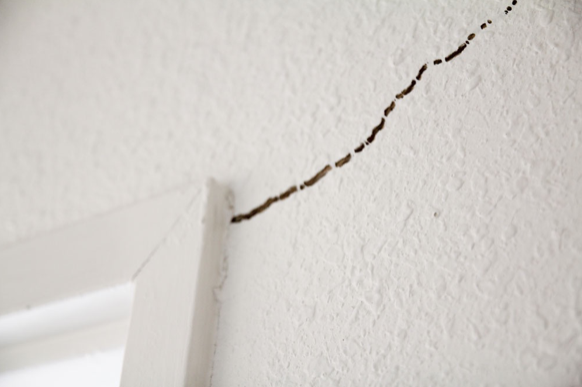 crack in sheetrock by doorway 